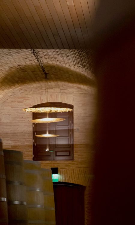 Barrels under the vaulted ceiling of Vega Sicilia's cellar