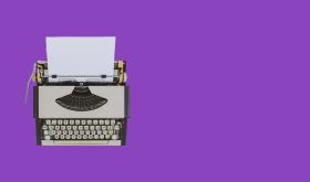 Typewriter on violet background