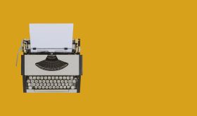 Typewriter on sienna background