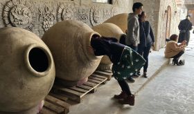 The author examining the inside of a karas at Voskevaz Winery, Armenia