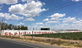 Claudia Sheinbaum Presidente graffiti painted on a wall off the highway in Mexico