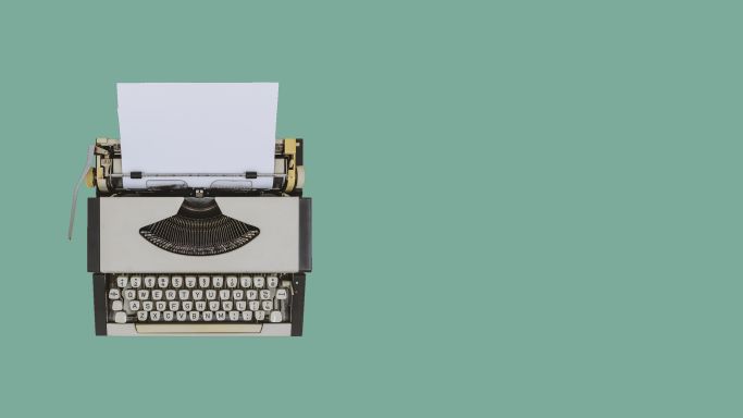 typewriter on sea green Background