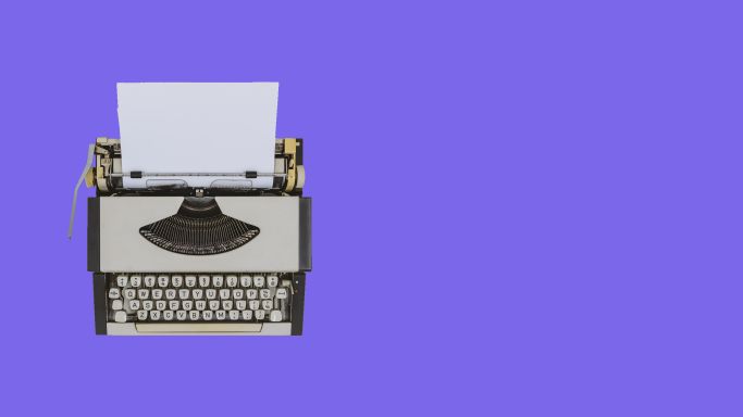 Typewriter on a violet background. Credit belongs to Constantine Johnny.