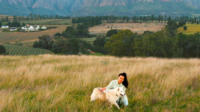 Brookdale - Kiara Scott and dog Pepper in the vlei in front of the homestead