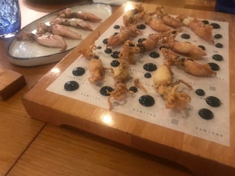 A dainty board of squid with black ink at Estimar restaurant in Barcelona
