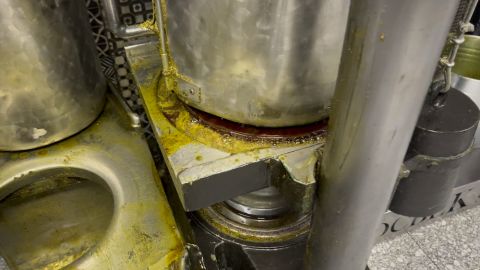 Oil beginning to flow from the press