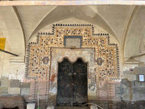Vine mural round the entrance to Greek church in Mustafapaşa