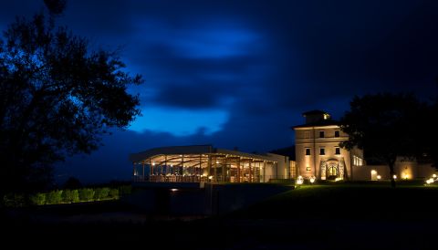 Cincinnato's restored 19th-century farmhosue and event space at night