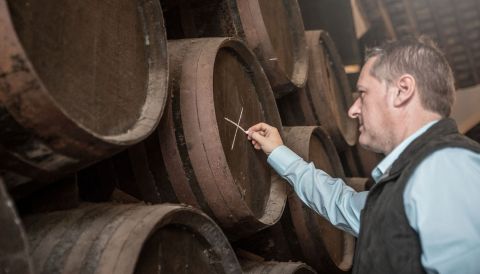 Capitaz Sergio Martínez marking barrels of sherry to determine what sort of sherry they will become